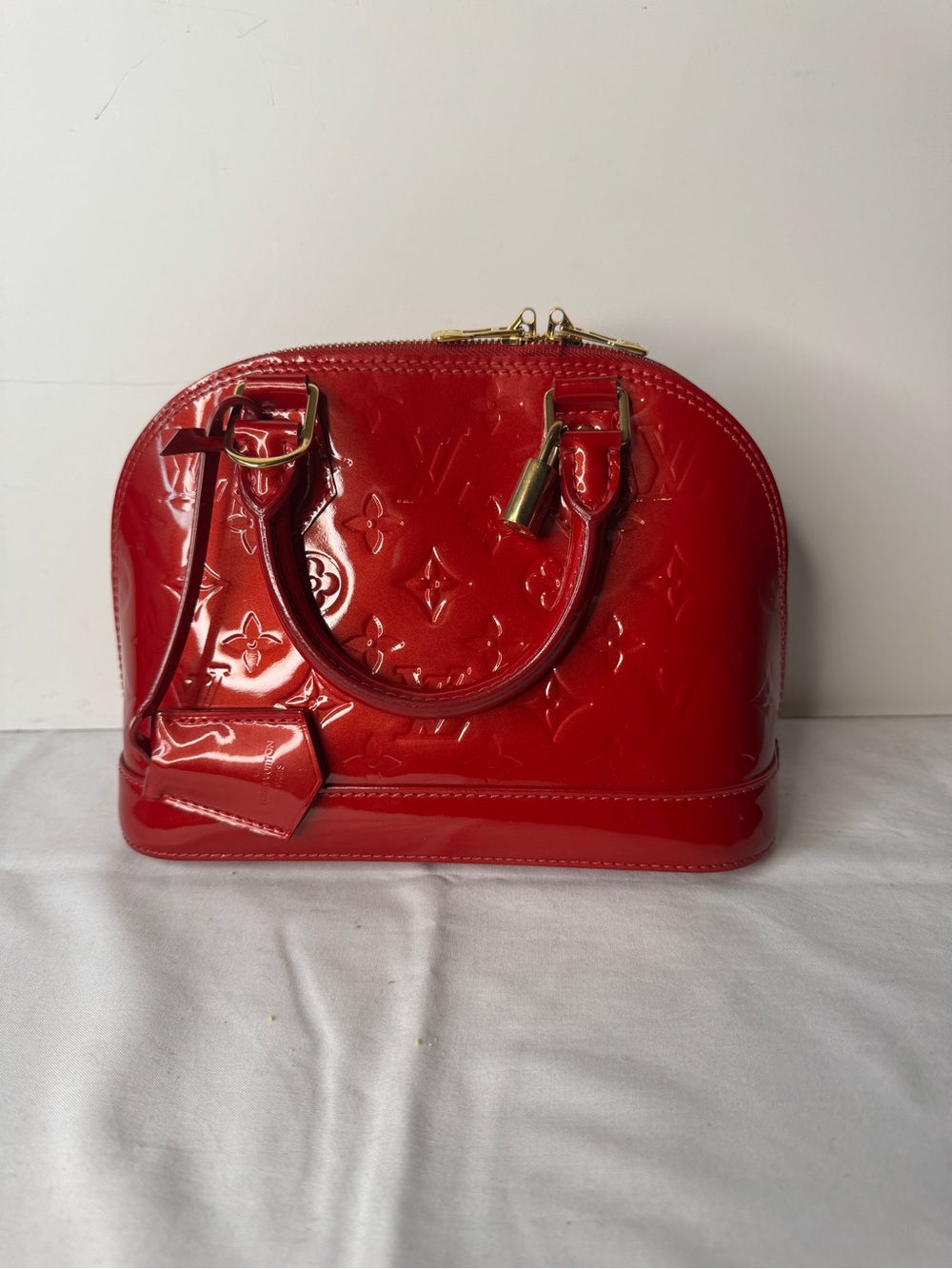 Louis Vuitton Red Vernis Alma BB Indian Rose Satchel with Gold Hardware.